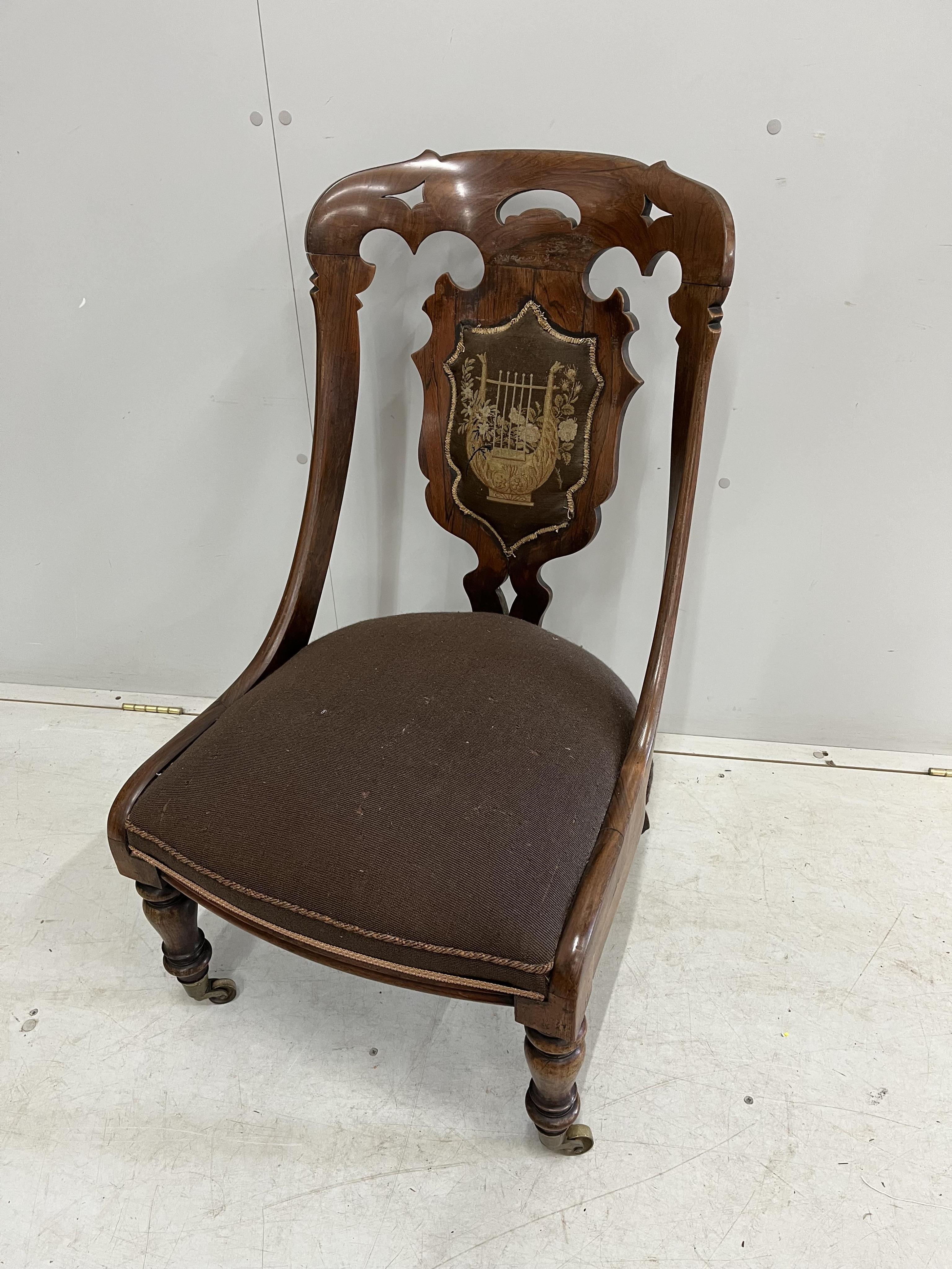A Victorian rosewood side chair, width 52cm, height 87cm. Condition - fair